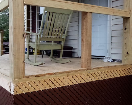 photo of a deck with wire cable spindles