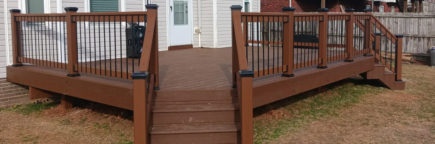 Dark stained wood deck with metal railing 